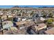 An aerial view captures the neighborhood with mountain views, displaying the layout and nearby amenities at 5184 Mineral Lake Dr, Las Vegas, NV 89122