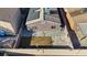 An aerial view of a private backyard with grass, patio, and rooftop solar panels on a sunny day at 5184 Mineral Lake Dr, Las Vegas, NV 89122