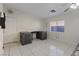 Versatile bedroom with tile floors offers ample space and natural light at 5184 Mineral Lake Dr, Las Vegas, NV 89122