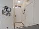 Welcoming entryway featuring tile flooring and convenient access to both the front door and garage at 5184 Mineral Lake Dr, Las Vegas, NV 89122