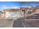Inviting home features a tidy front yard, two-car garage and cozy entry at 5184 Mineral Lake Dr, Las Vegas, NV 89122
