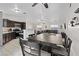 Kitchen with stainless steel appliances, granite countertops, and a dining area with seating for six at 5184 Mineral Lake Dr, Las Vegas, NV 89122