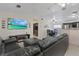 Spacious living room boasts tile flooring and a cozy fireplace beneath a large flat-screen TV at 5184 Mineral Lake Dr, Las Vegas, NV 89122