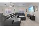 Comfortable living room featuring a large sectional sofa and a modern entertainment center at 5184 Mineral Lake Dr, Las Vegas, NV 89122