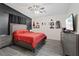 Comfortable main bedroom with a queen bed, ceiling fan, and stylish decor at 5184 Mineral Lake Dr, Las Vegas, NV 89122