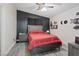 Comfortable main bedroom with a queen bed, ceiling fan, and stylish decor at 5184 Mineral Lake Dr, Las Vegas, NV 89122