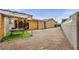 Large backyard featuring gravel landscaping and a wood-framed outdoor living space at 54 Del Amo Dr, Las Vegas, NV 89110