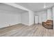 Finished basement area with laminate flooring, neutral walls, and additional seating at 54 Del Amo Dr, Las Vegas, NV 89110
