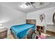 Simple bedroom features a bed, workspace, and a neutral color scheme for a restful ambiance at 54 Del Amo Dr, Las Vegas, NV 89110