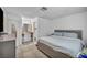 Cozy main bedroom featuring plush king bed and ensuite bathroom with decorative mirror at 54 Del Amo Dr, Las Vegas, NV 89110