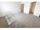 Simple bedroom with neutral carpet and an open closet space, flooded with natural light at 5415 W Harmon Ave # 2048, Las Vegas, NV 89103