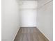 Walk-in closet featuring neutral carpet and white wire shelving for organized storage solutions at 5415 W Harmon Ave # 2048, Las Vegas, NV 89103