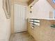 A condo front door is accessible with a gated entrance and has a porch and desert landscaping at 5415 W Harmon Ave # 2048, Las Vegas, NV 89103