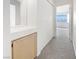 Hallway with carpeting and a storage area, and a glimpse of a bedroom with a view at 5415 W Harmon Ave # 2048, Las Vegas, NV 89103