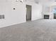 Spacious living room with neutral carpet, recessed lighting, a fireplace and entry to a bathroom at 5415 W Harmon Ave # 2048, Las Vegas, NV 89103