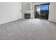 Cozy living room with a decorative fireplace and sliding doors leading to a balcony with a view at 5415 W Harmon Ave # 2048, Las Vegas, NV 89103
