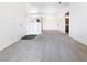 Bright and airy living room featuring neutral carpet, chandelier lighting, and an open floor plan at 5415 W Harmon Ave # 2048, Las Vegas, NV 89103