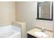A bathroom featuring a single sink vanity and framed mirror at 5650 E Sahara Ave # 2062, Las Vegas, NV 89142