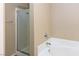 A bathtub and glass shower with tile surround at 5650 E Sahara Ave # 2062, Las Vegas, NV 89142
