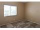 Bedroom with carpet flooring, window, and neutral walls at 5650 E Sahara Ave # 2062, Las Vegas, NV 89142