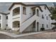 A multi-level condo with stucco walls, outdoor stairway access, and neat landscaping at 5650 E Sahara Ave # 2062, Las Vegas, NV 89142
