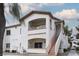 Inviting multi-level home with a private balcony, stucco walls, and stairway access to each level at 5650 E Sahara Ave # 2062, Las Vegas, NV 89142
