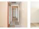 Hallway with carpet, a utility closet, and an entry to a bedroom at 5650 E Sahara Ave # 2062, Las Vegas, NV 89142