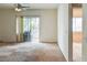 Living room with carpet, ceiling fan, and sliding glass doors to a balcony at 5650 E Sahara Ave # 2062, Las Vegas, NV 89142