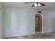 Open-concept living space with a ceiling fan and view into an adjacent bathroom at 5650 E Sahara Ave # 2062, Las Vegas, NV 89142