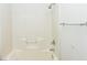 A white tile shower and bath combo at 5650 E Sahara Ave # 2062, Las Vegas, NV 89142