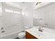 Clean bathroom with a tub, shower, and a large mirror above the sink at 6029 Mustang Breeze Trl # 101, Henderson, NV 89011