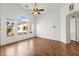 Bright and airy bedroom with large windows and beautiful hardwood floors at 6029 Mustang Breeze Trl # 101, Henderson, NV 89011