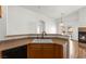 Kitchen featuring breakfast bar and open layout at 6029 Mustang Breeze Trl # 101, Henderson, NV 89011