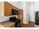 Kitchen features modern black appliances and plenty of cabinet storage at 6029 Mustang Breeze Trl # 101, Henderson, NV 89011
