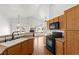Well-lit kitchen equipped with essential appliances and ample counter space at 6029 Mustang Breeze Trl # 101, Henderson, NV 89011