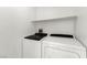 Laundry room featuring a washer and dryer hookups and shelving at 6029 Mustang Breeze Trl # 101, Henderson, NV 89011