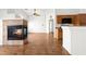 Living area featuring cozy fireplace and breakfast bar at 6029 Mustang Breeze Trl # 101, Henderson, NV 89011