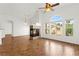 Open-concept living room with fireplace and ample natural light at 6029 Mustang Breeze Trl # 101, Henderson, NV 89011