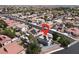 Neighborhood aerial view pinpointing a property with solar panels and a backyard swimming pool at 6313 Giant Oak St, North Las Vegas, NV 89084