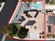 Bird's-eye view of property highlighting solar panels, swimming pool, and fully fenced yard at 6313 Giant Oak St, North Las Vegas, NV 89084