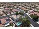 Breathtaking aerial view showcasing a residential area with homes, pools, and lush landscaping at 6313 Giant Oak St, North Las Vegas, NV 89084