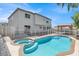 Backyard pool and spa with steps into the water, with gazebo at 6313 Giant Oak St, North Las Vegas, NV 89084