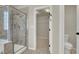 Bathroom showcasing a glass shower, toilet, and access to a walk-in closet at 6313 Giant Oak St, North Las Vegas, NV 89084