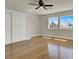 Spacious bedroom with hardwood floors, closet and windows offering natural light and neighborhood views at 6313 Giant Oak St, North Las Vegas, NV 89084