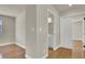 Bedroom showcasing hardwood floors, a window, and access to the bathroom at 6313 Giant Oak St, North Las Vegas, NV 89084
