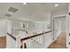 Hallway featuring white railings and trim with hardwood floors at 6313 Giant Oak St, North Las Vegas, NV 89084