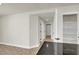 Bright hallway featuring tile flooring, pantry access, and multiple entryways for easy navigation at 6313 Giant Oak St, North Las Vegas, NV 89084