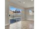 Bright room with a sliding glass door that shows the patio area at 6313 Giant Oak St, North Las Vegas, NV 89084