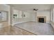 Open-concept living room with tile floors, fireplace, and a bright and airy atmosphere at 6313 Giant Oak St, North Las Vegas, NV 89084
