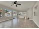 Sun-filled living room with tile floors, backyard access, and open flow to the kitchen at 6313 Giant Oak St, North Las Vegas, NV 89084
